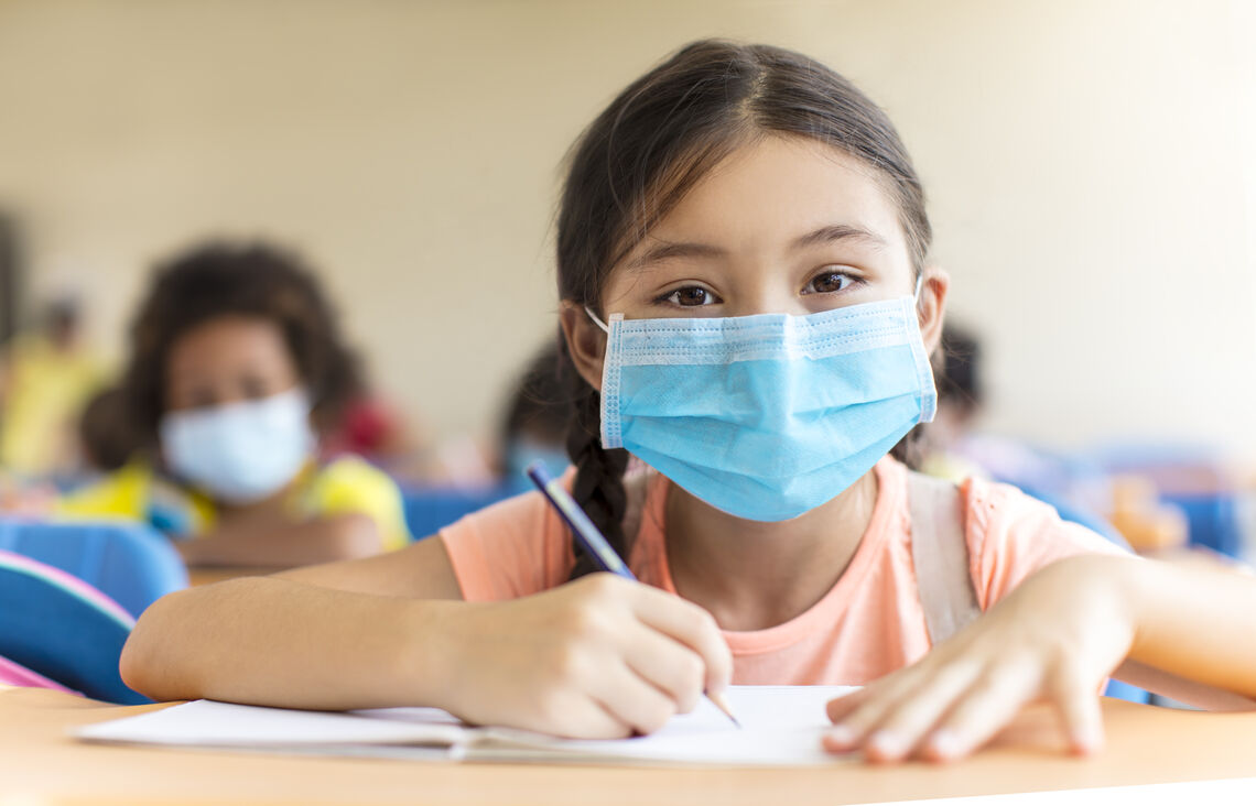 students wearing  mask and studying in the classroom