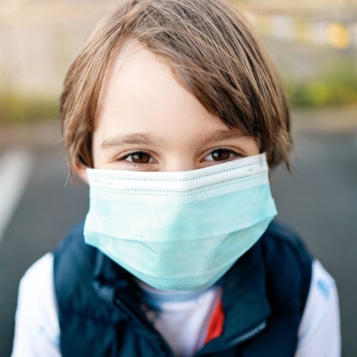 little boy wearing medical mask during coronavirus covid19 pandemic