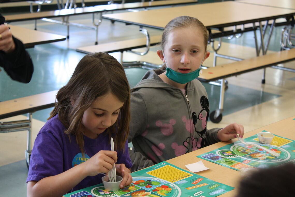 Two elementary school girls in the cafeteria
